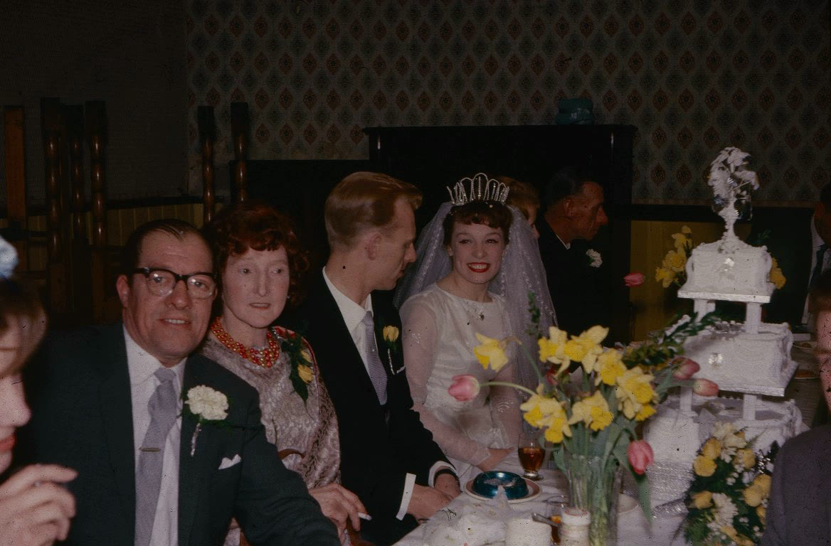 A faded colour photograph of a wedding reception